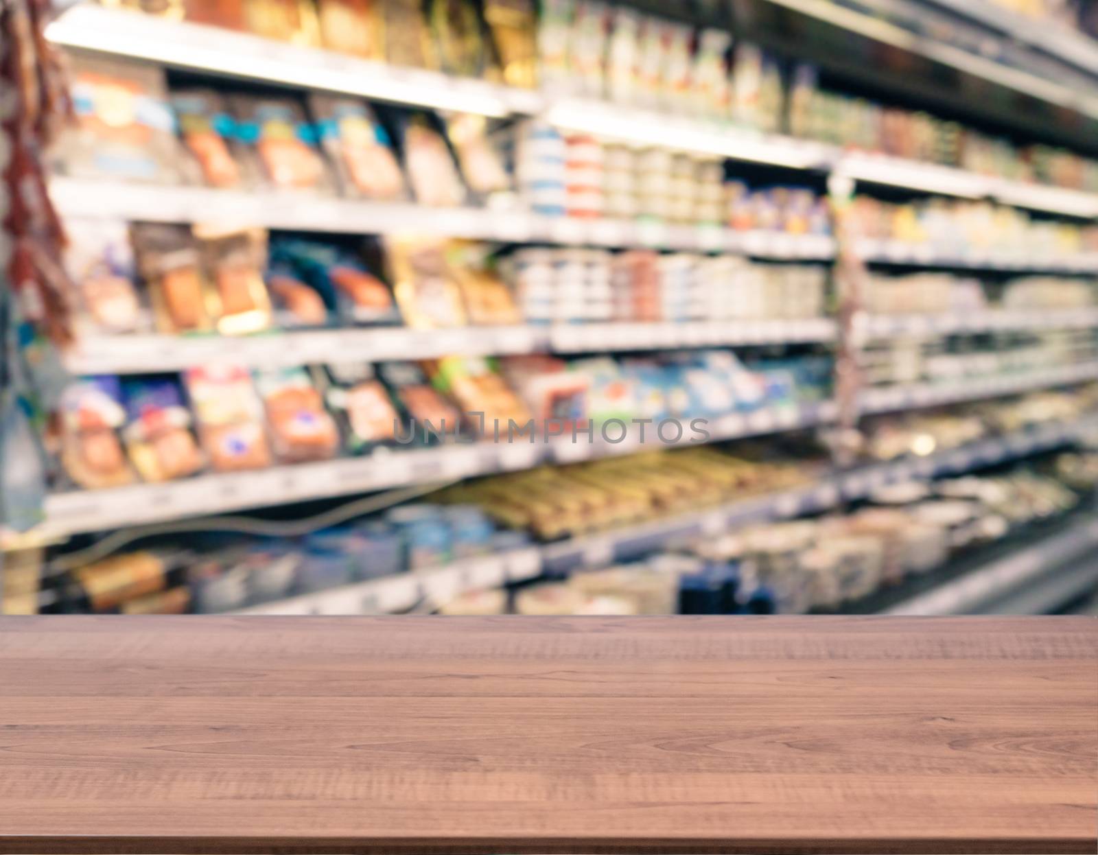 Brown wooden board empty table in front of blurred background. Perspective dark wood over blur in supermarket - can be used for display or montage your products. Mockup for display of product.