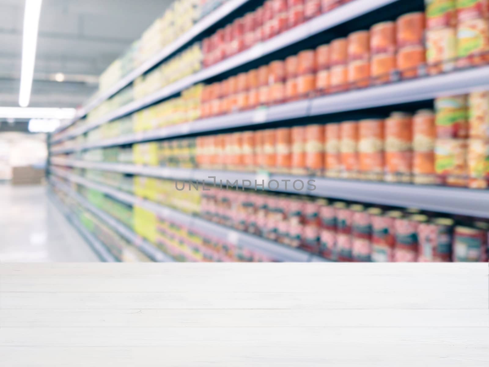  Blurred colorful supermarket products on shelves by fascinadora