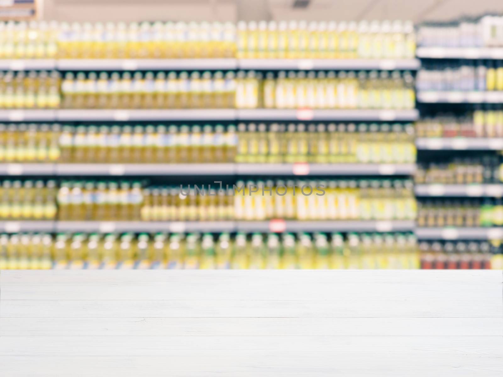  Blurred colorful supermarket products on shelves by fascinadora