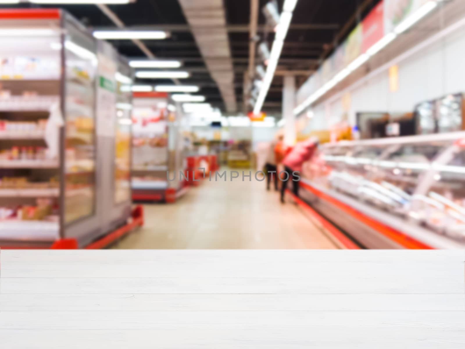 White wooden board empty table in front of blurred background. Perspective white wood over blur in supermarket - can be used for display or montage your products. Mockup for display of product.