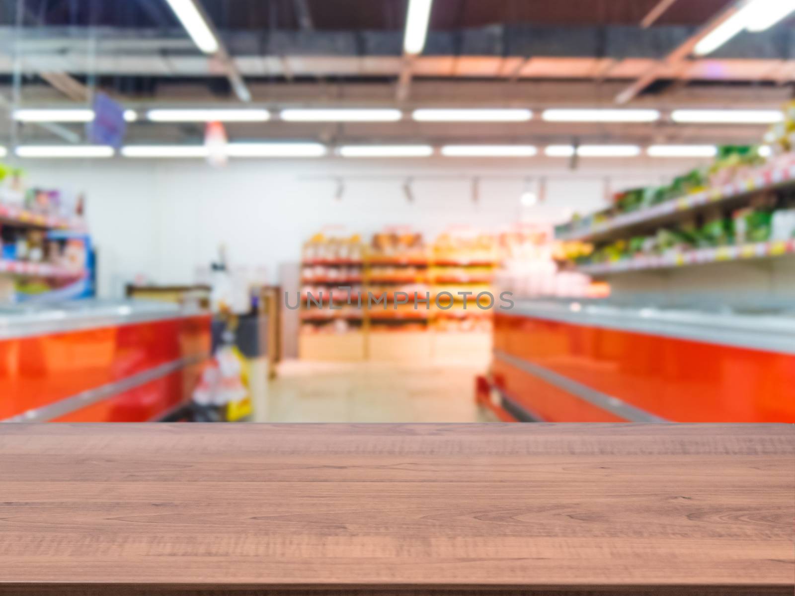 Brown wooden board empty table in front of blurred background. Perspective dark wood over blur in supermarket - can be used for display or montage your products. Mockup for display of product.