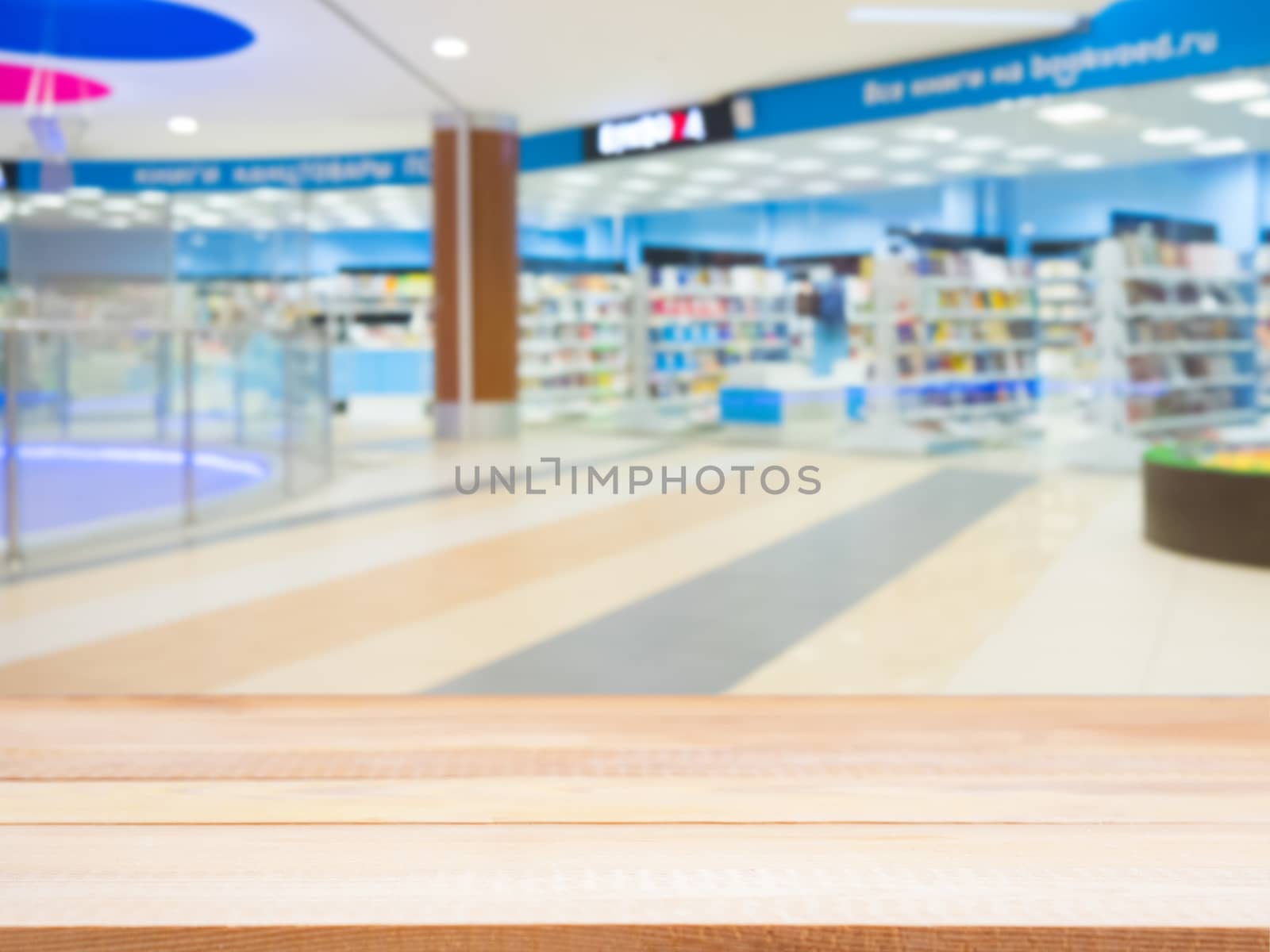 empty table and shopping mall blur by fascinadora