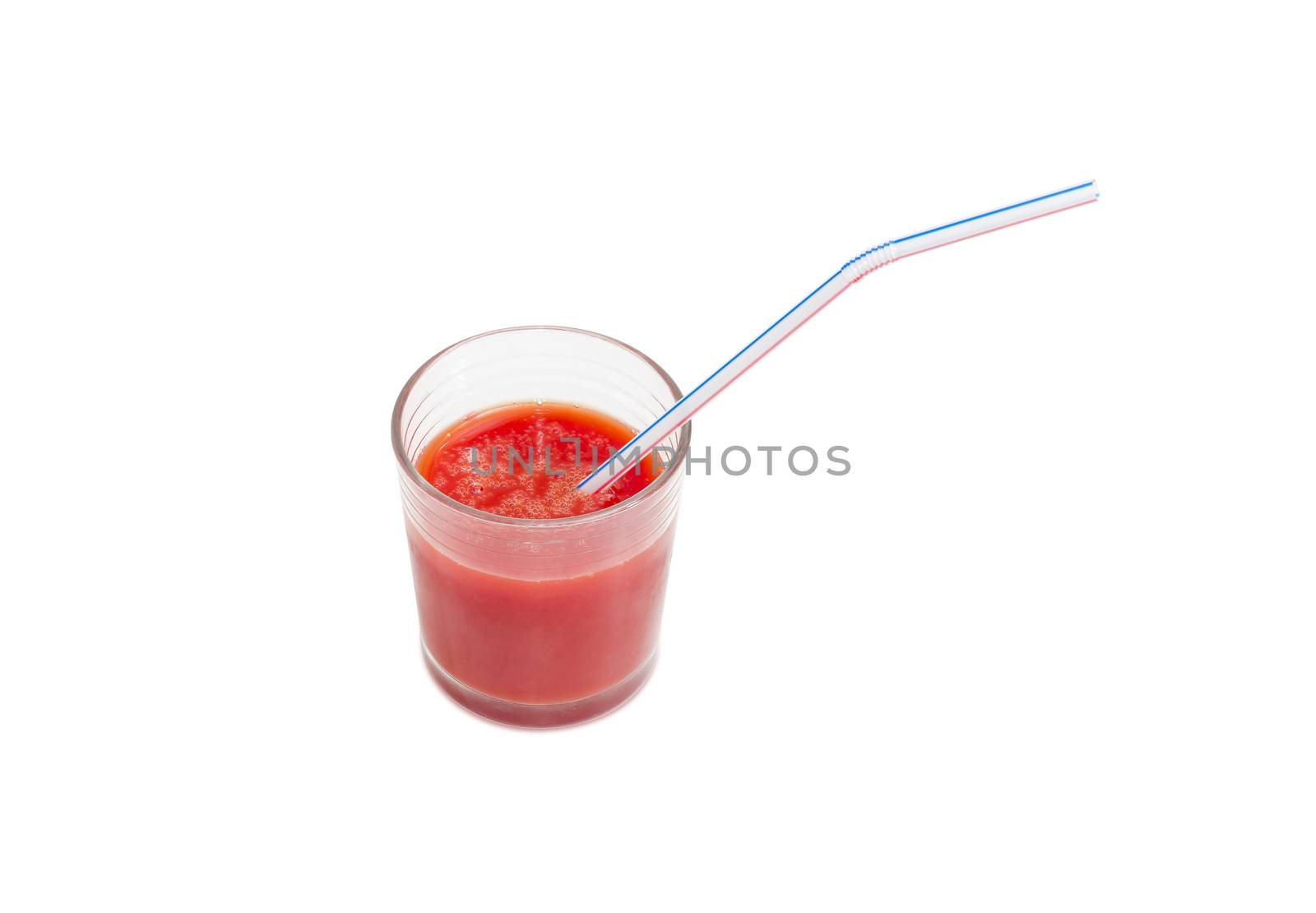 Tomato juice in glass with bendable drinking straw on a light background
