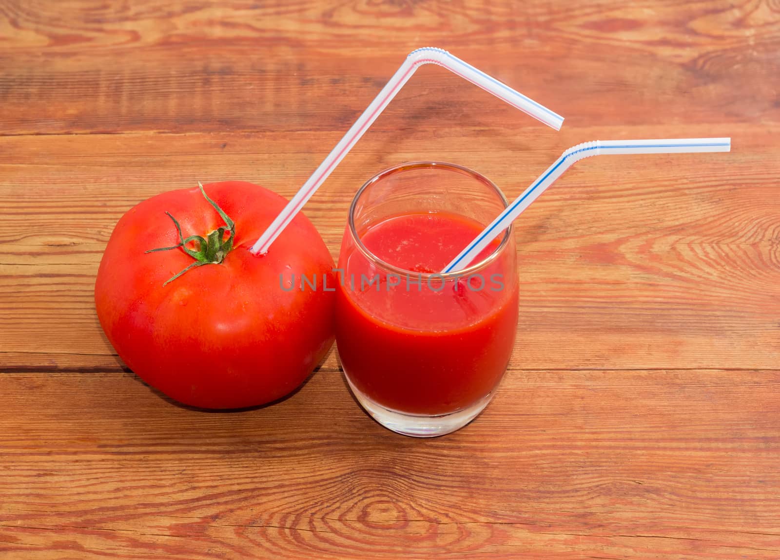 Drinking straws in tomato and tomato juice