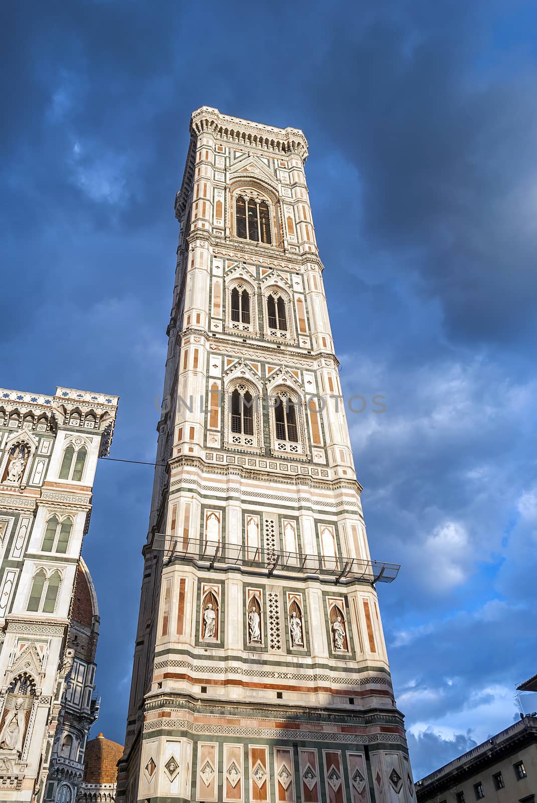 bottom view of the famous Campanile (tower bell) in a cloudy day in Florence, italy by rarrarorro