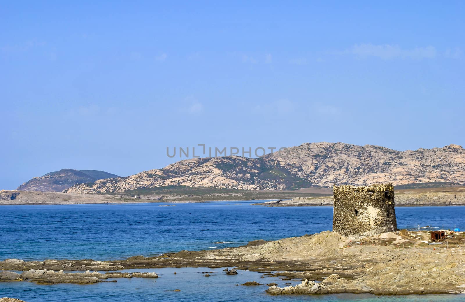 Amazing view of the famous La Pelosa Beach with the landmark 16th century Watchtower (Torre della Pelosa)