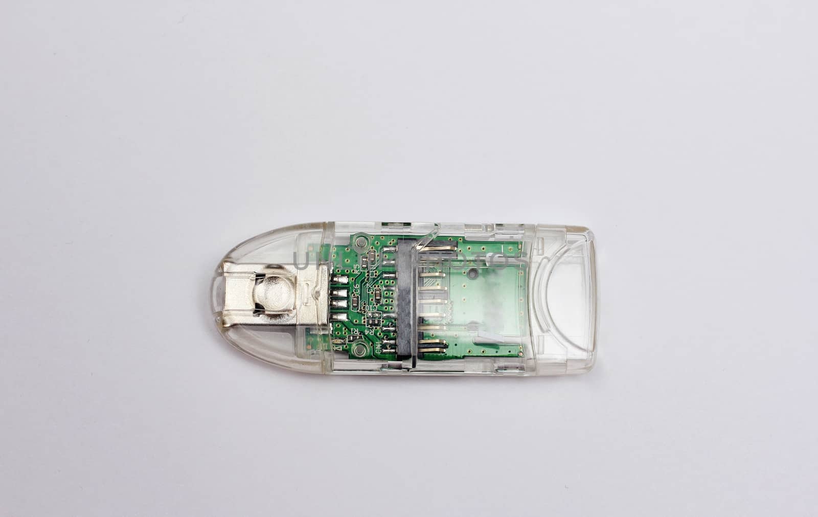 A device for reading memory cards in a translucent casing isolated against a white background.