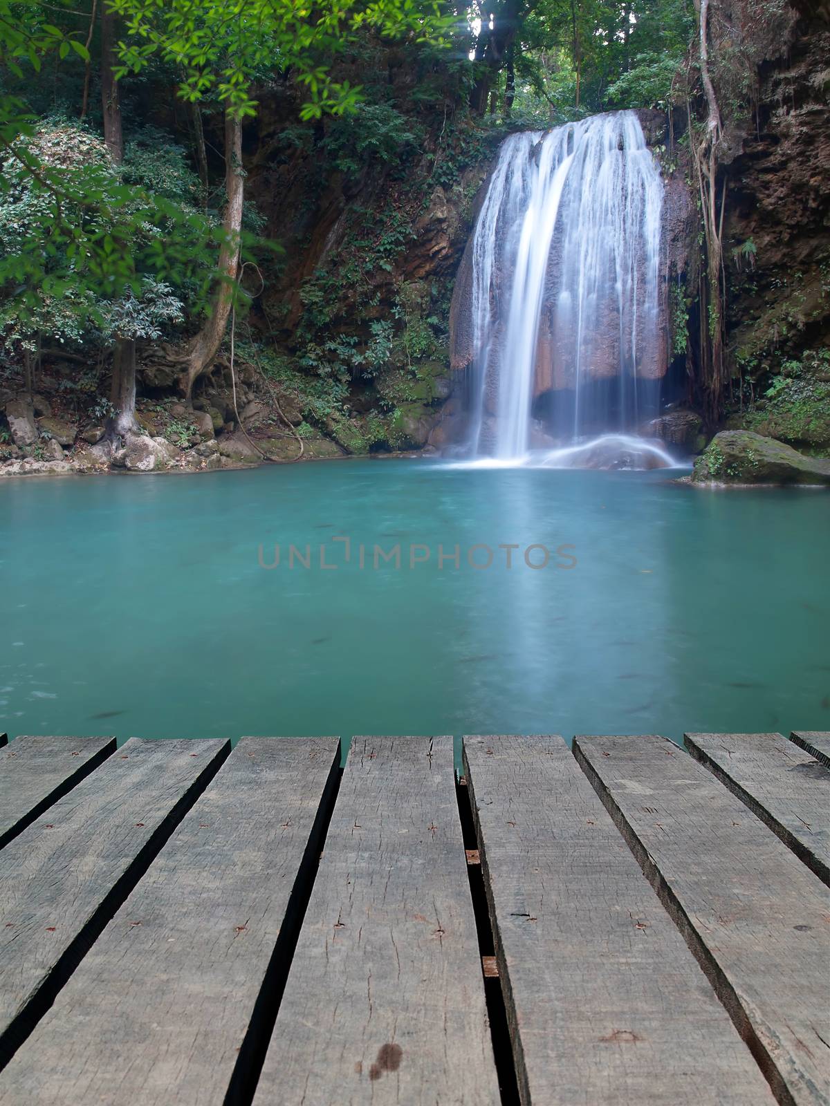 Boardwalk with tier third of Erawan waterfall