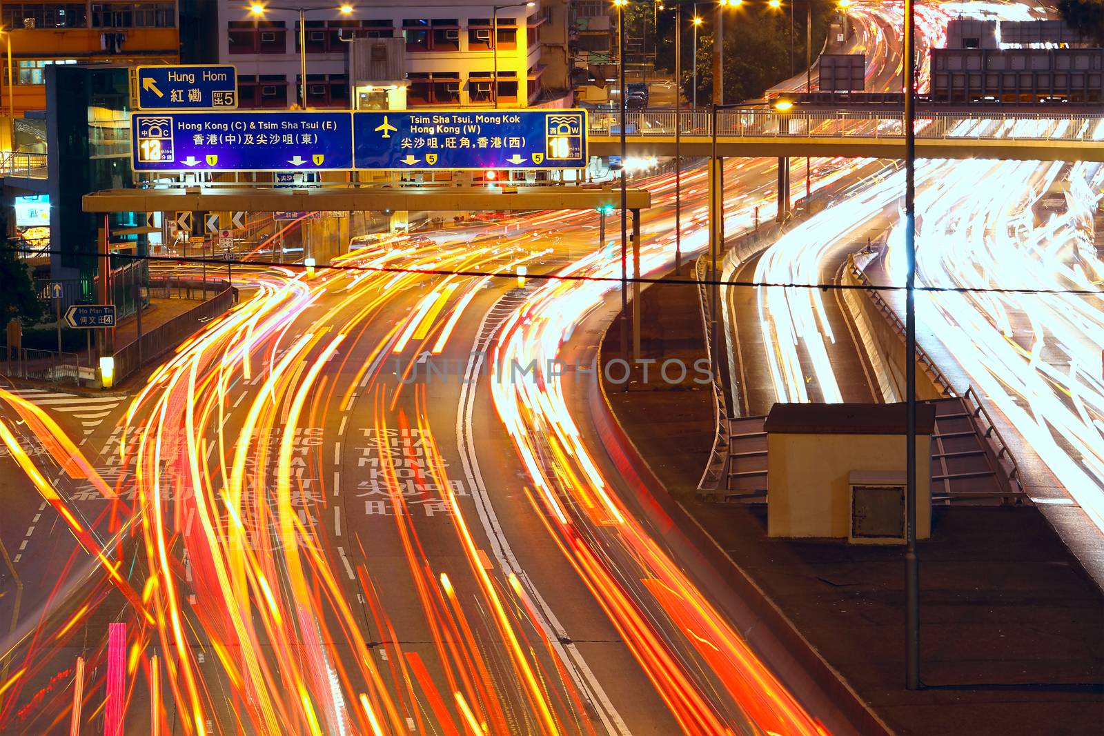 Traffic night in urban city by cozyta