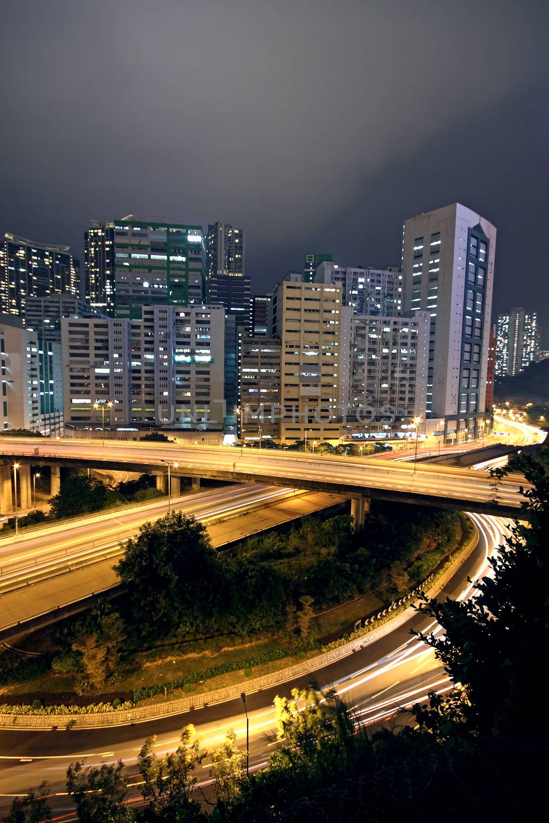 business area of hongkong at night by cozyta