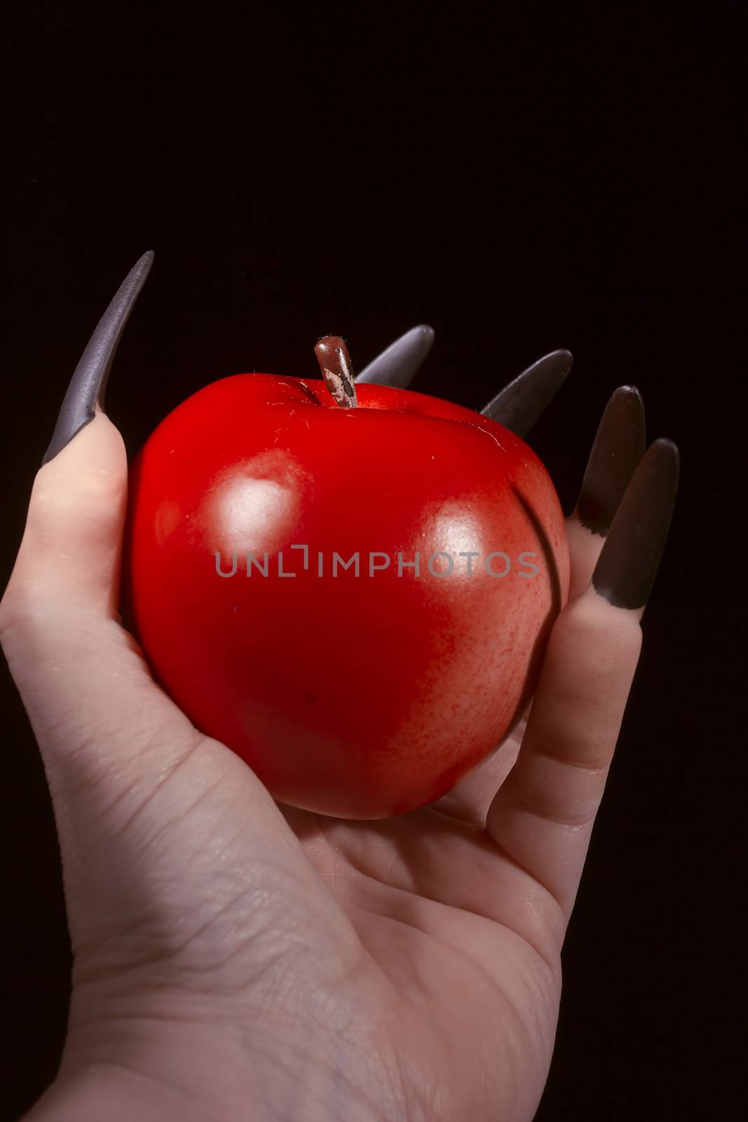 Apple in the hands with claws by VIPDesignUSA