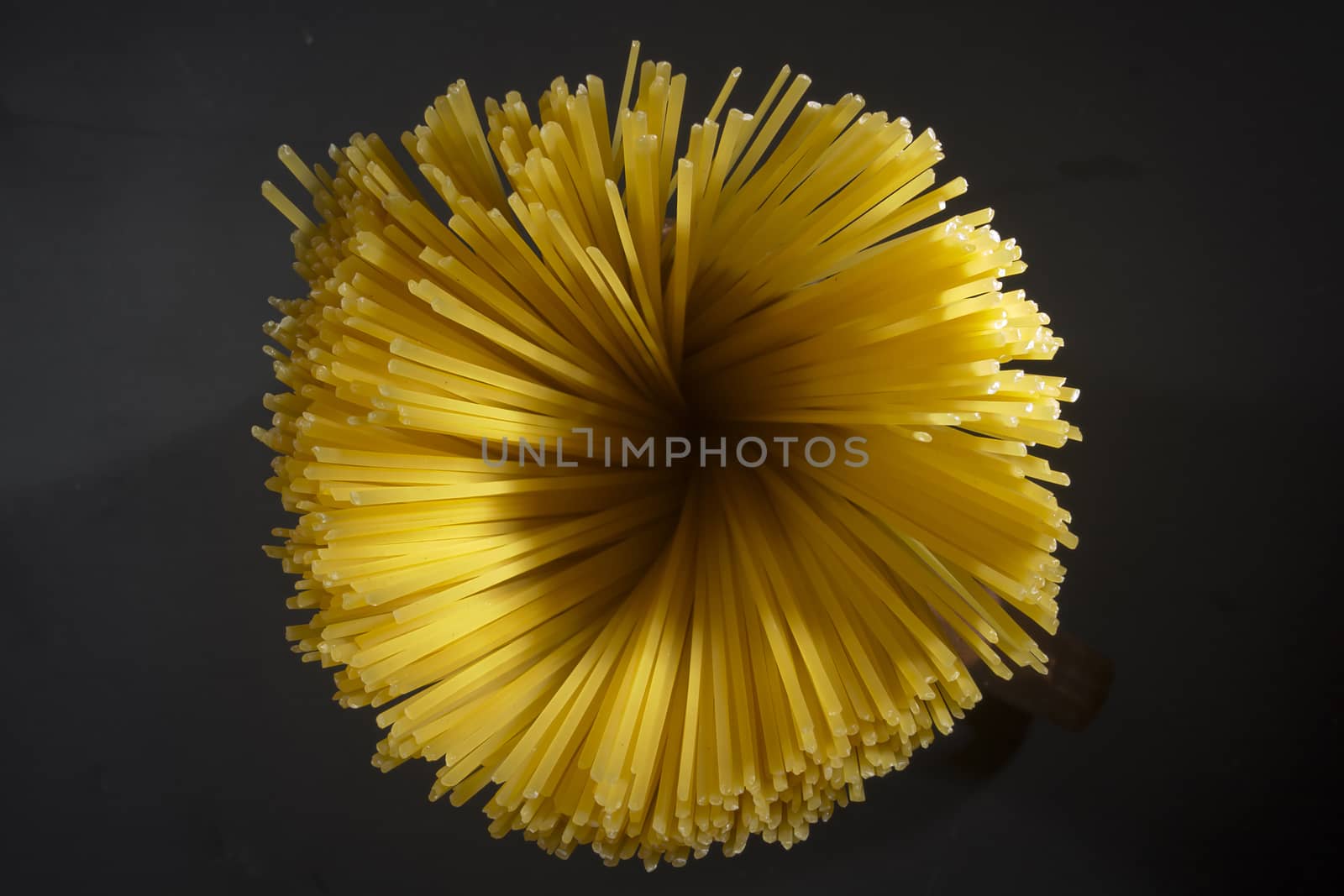 Beam of Italian pasta on a black background