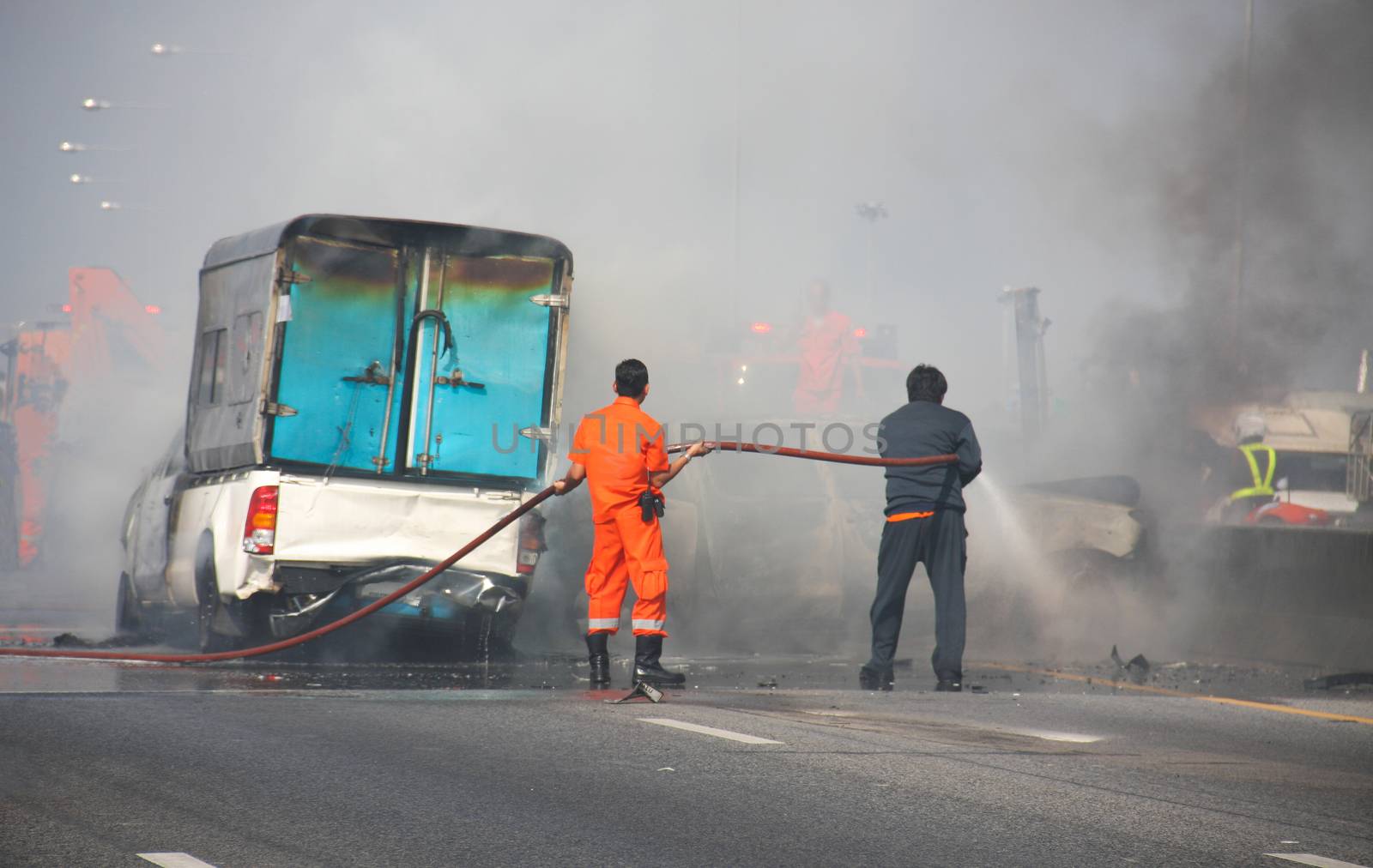 Firefighter fire brigade small truck car crash on motorway street, blur