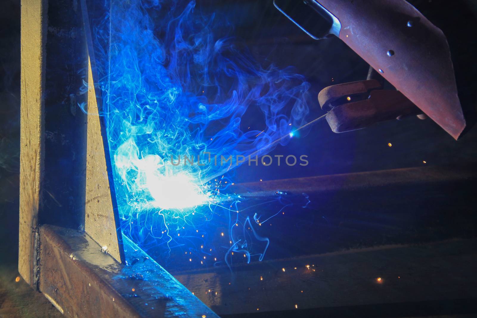 welding steel iron with blue smoke
