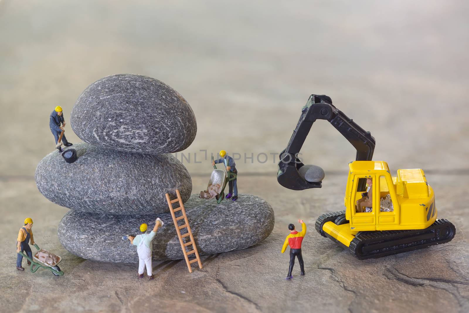 Pebbles stack and workers figurines