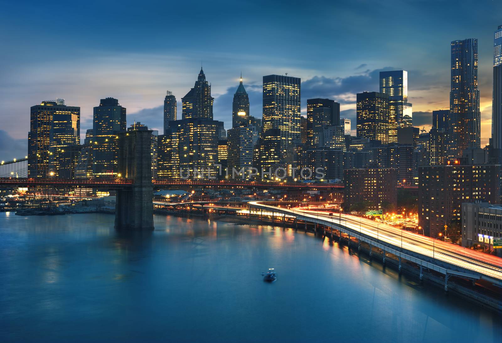 New York City - beautiful sunrise over manhattan with manhattan and brooklyn bridge USA