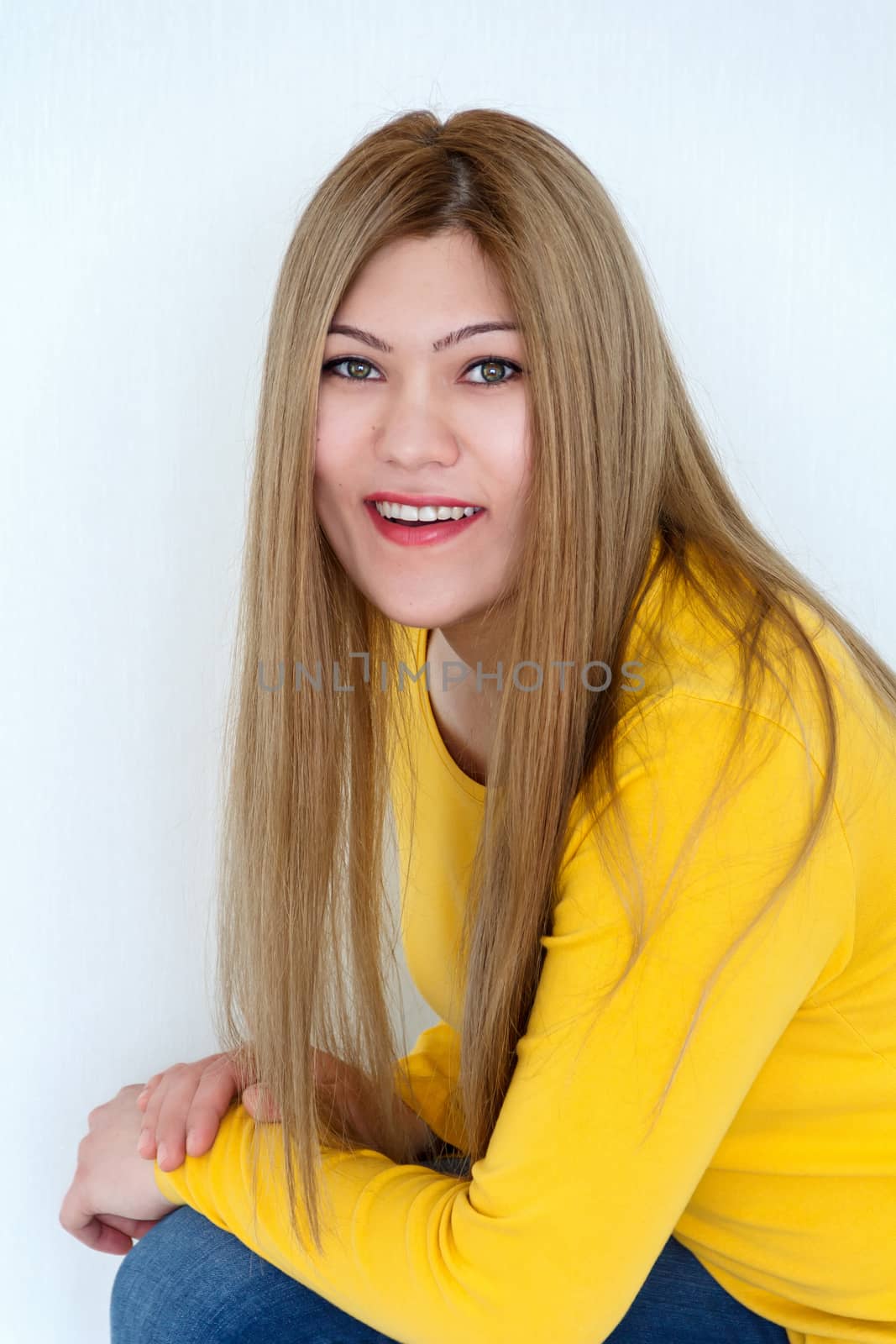 Vertical Attractive young girl with long brown healthy straight hair