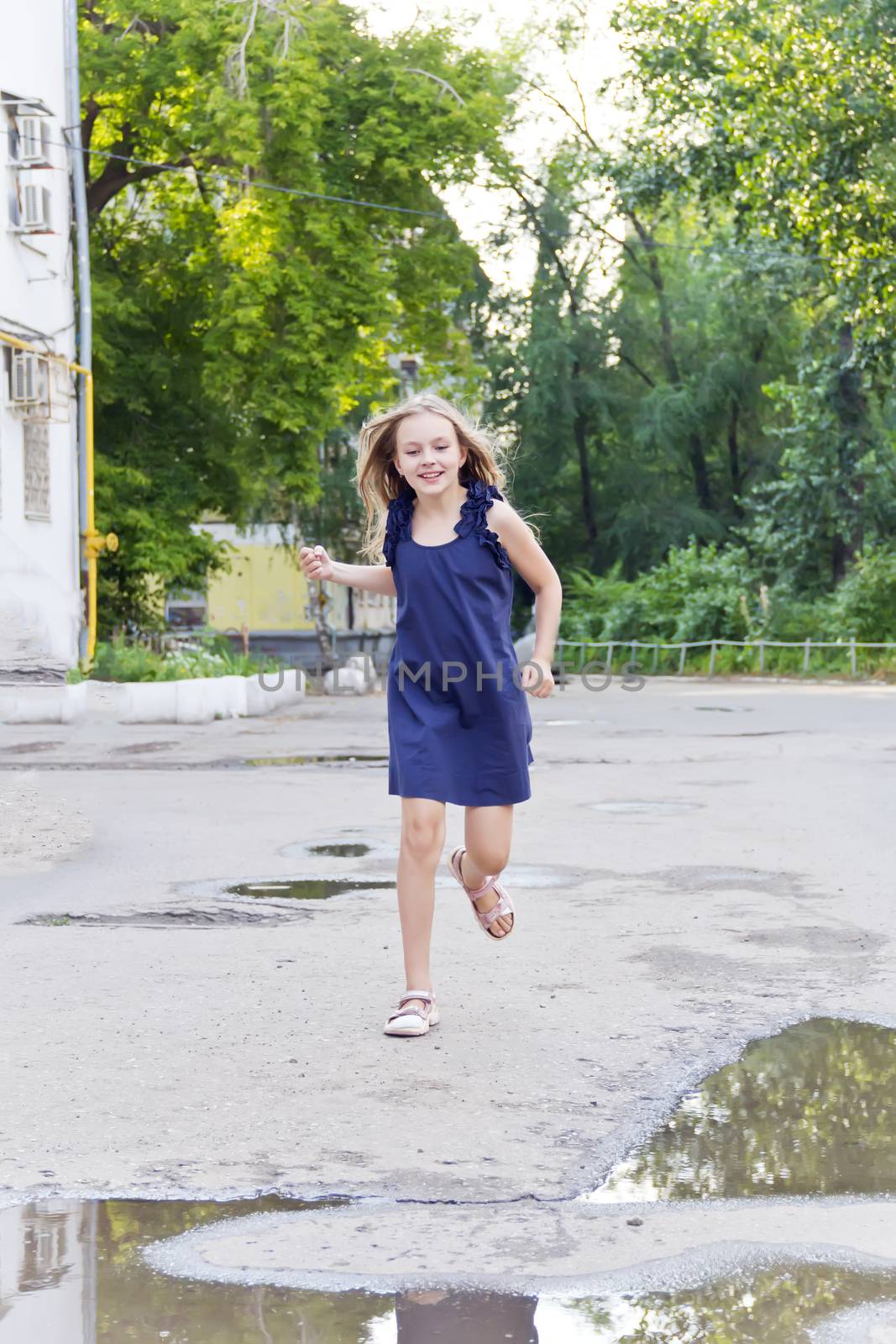 Caucasian girl run in summer with disheveled hair by Julialine