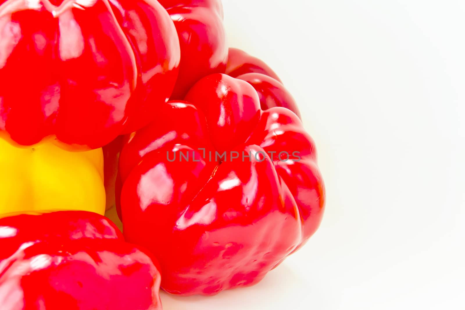 Red raw pepper on white by Julialine