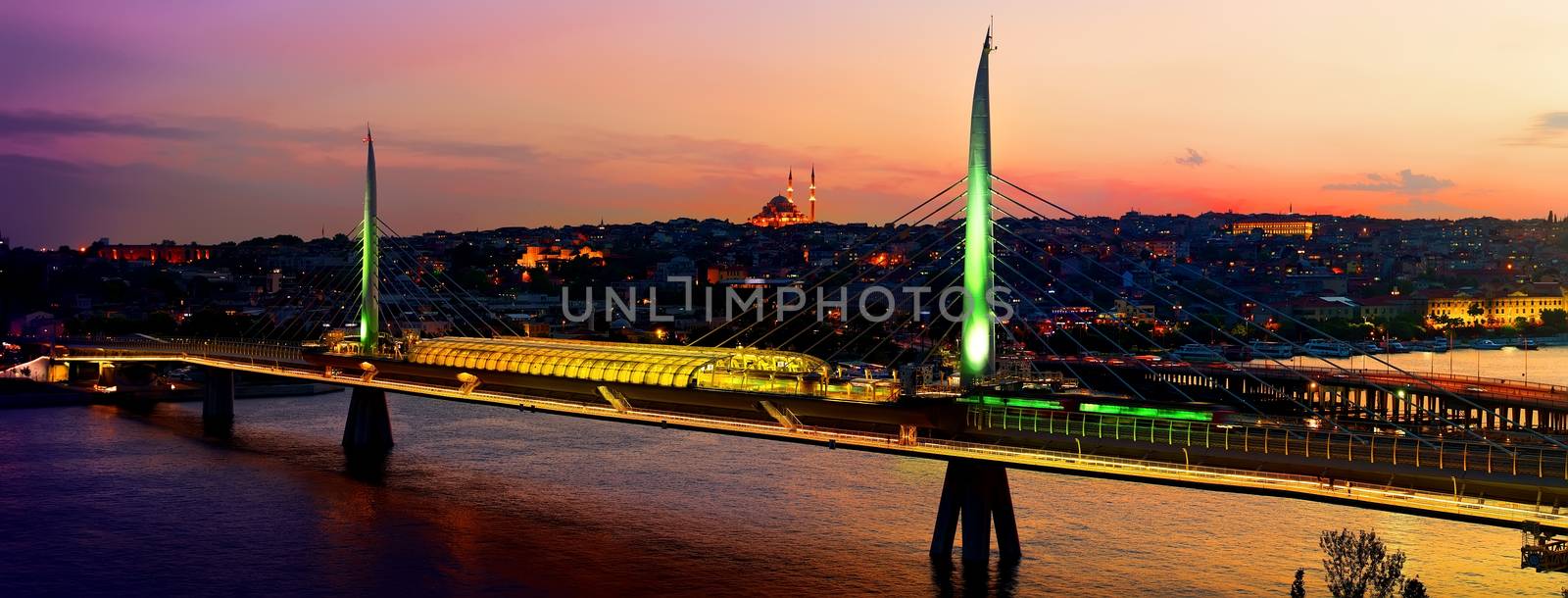Metro station on Golden Horn bridge in Istanbul at dusk, Turkey