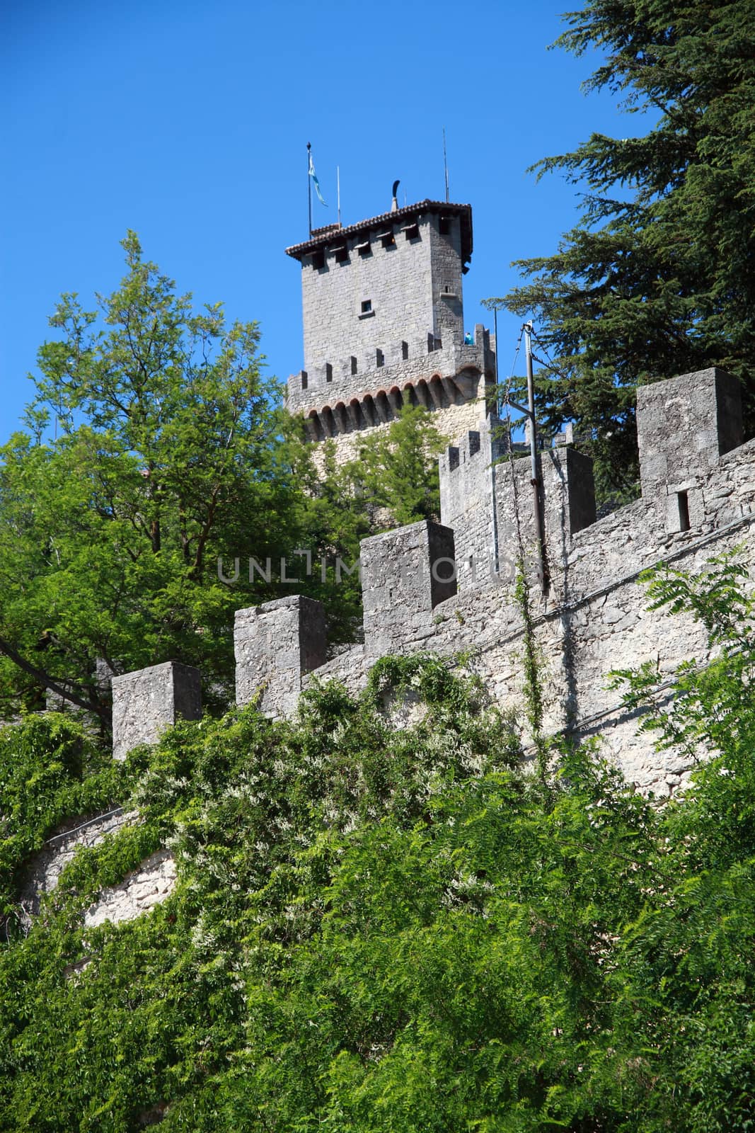 tower and the walls of the San Marino Castle by diecidodici