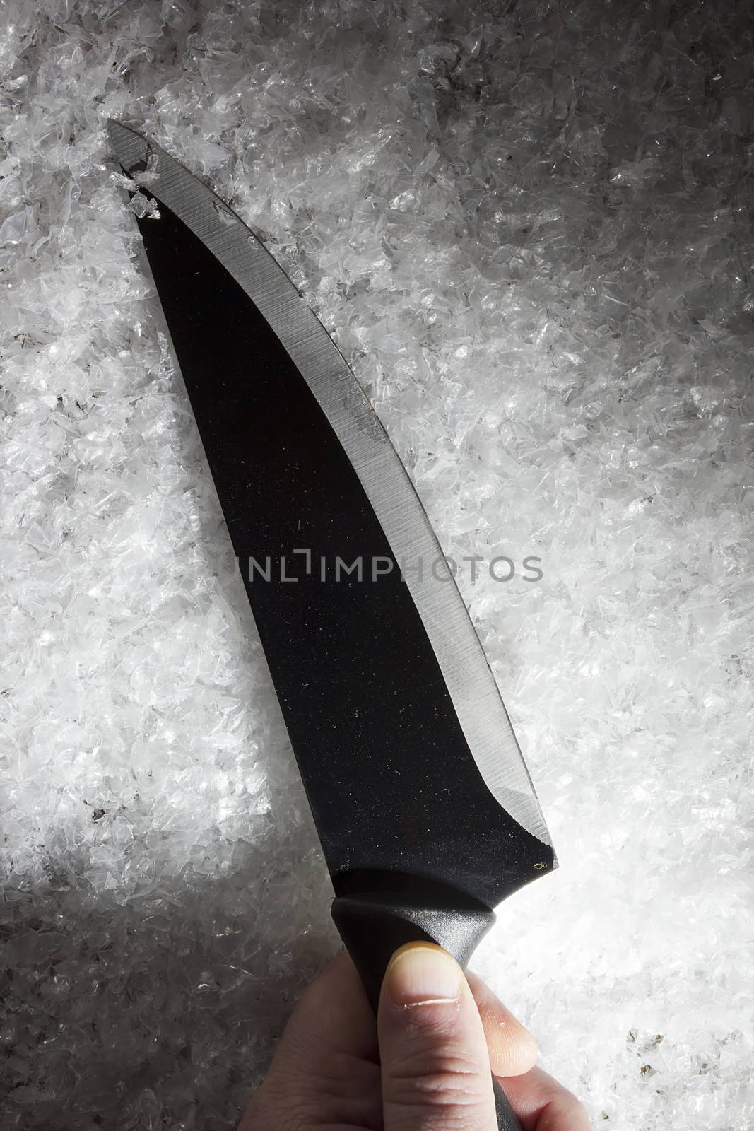 Hand and knife in the snow by VIPDesignUSA