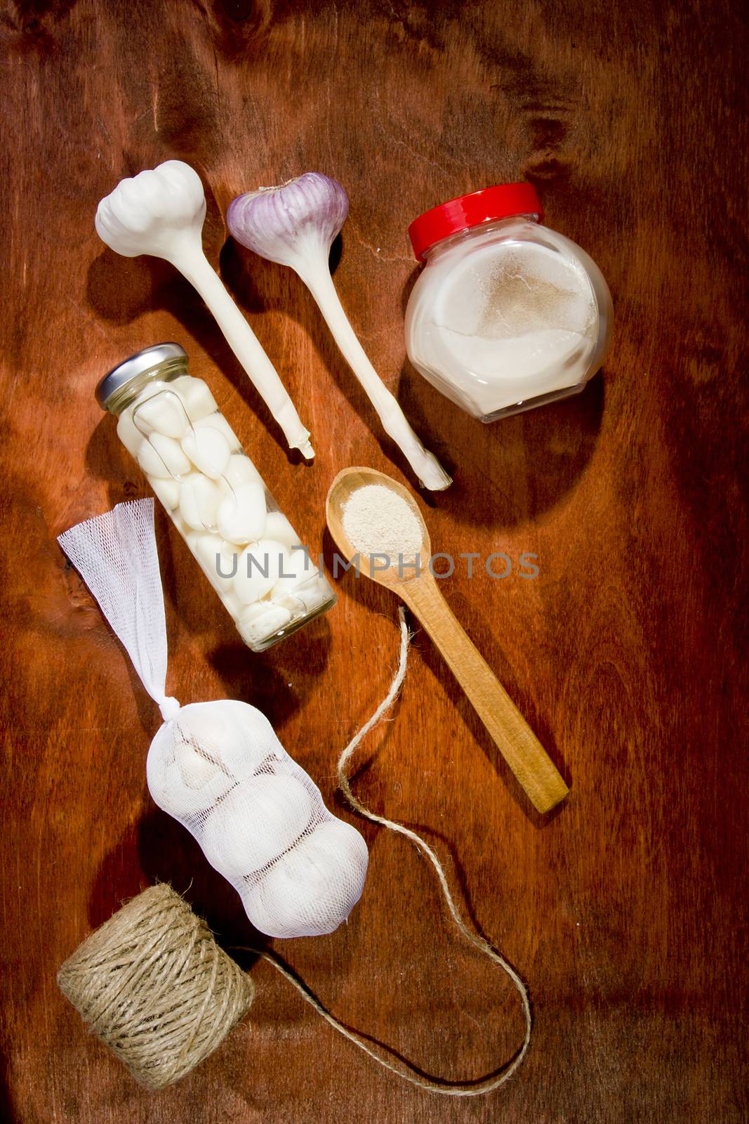 Varied garlic package on a wooden background