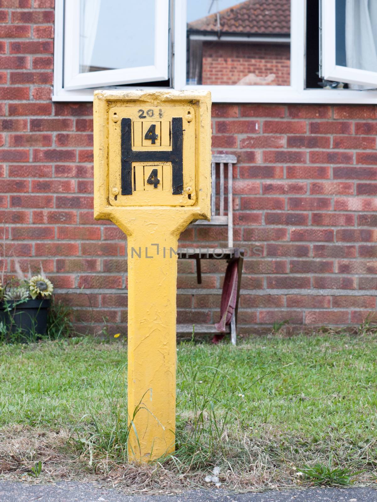 yellow h sign outside hydrant fire safety