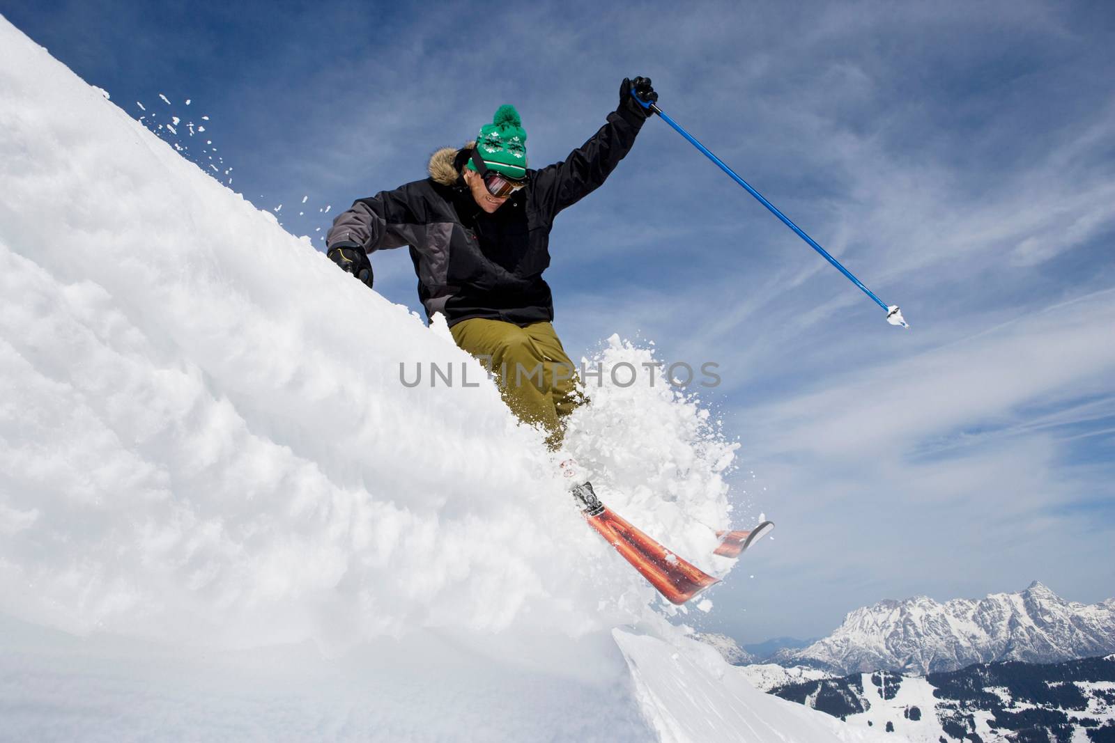 Skier jumping of a cornice