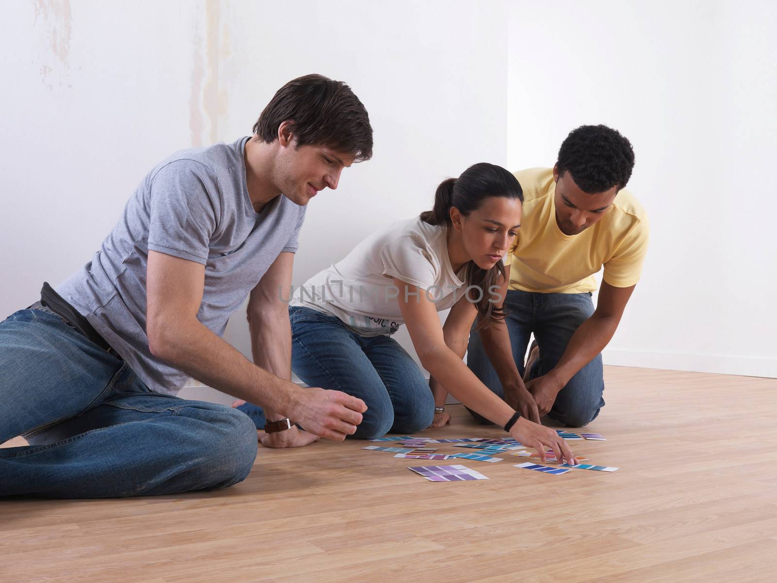 Group of friends choosing paint colours