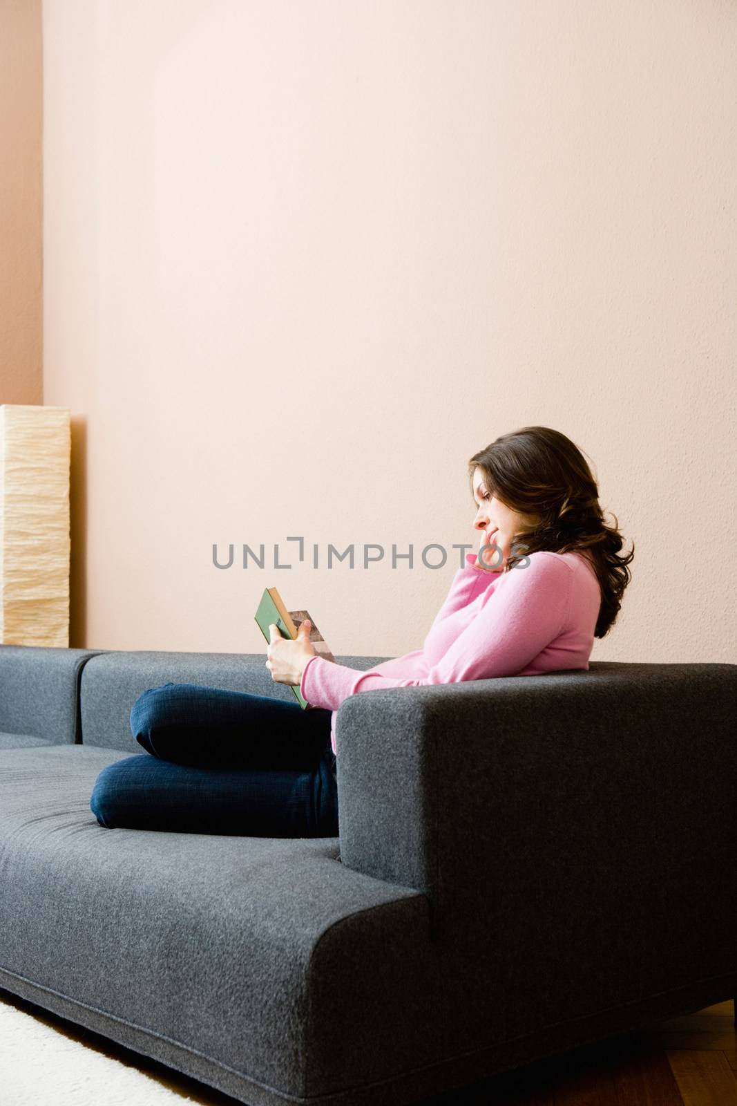 Pregnant woman reading a book