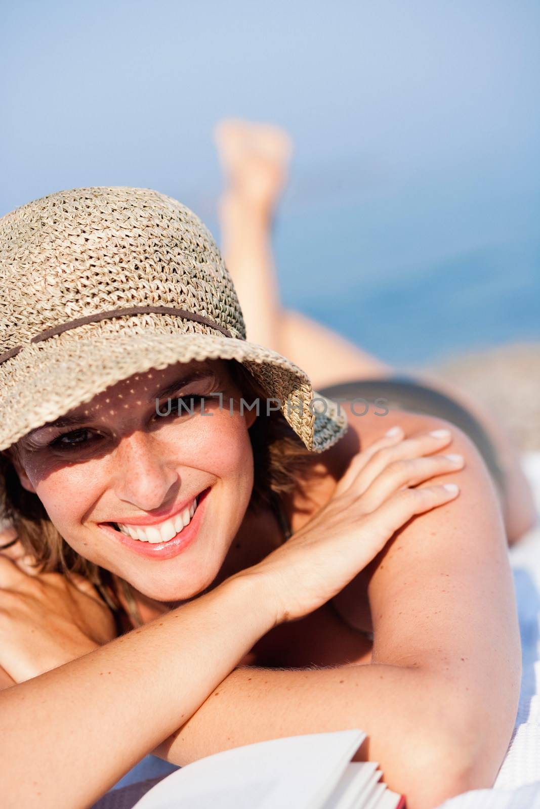 Woman laying on the beach