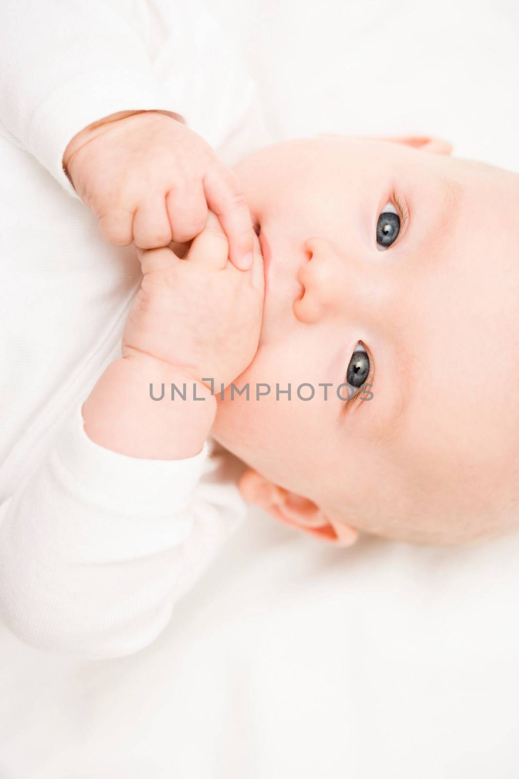 Baby smiling into camera