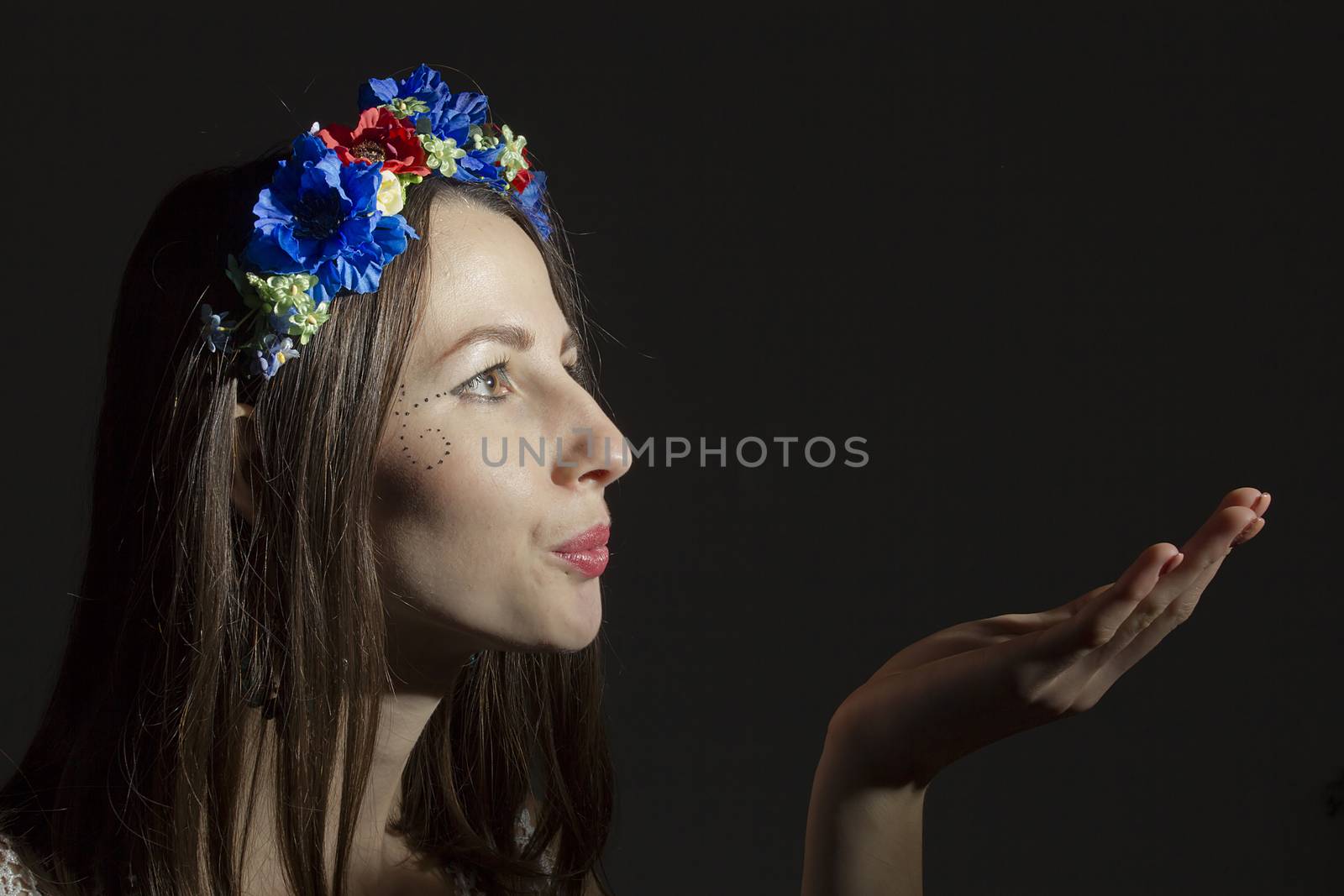 Portrait of a young woman in a wreath of flowers by VIPDesignUSA