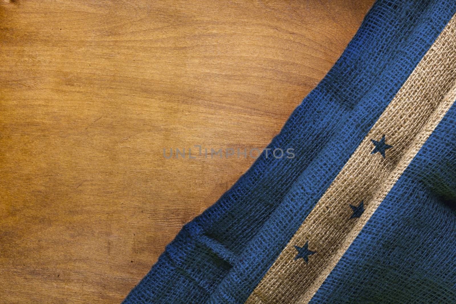 White blue flag of Honduras on a wooden background