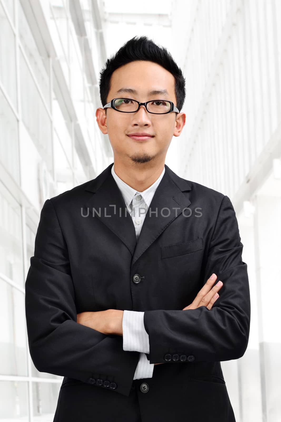 Confident Asian businessman  by szefei