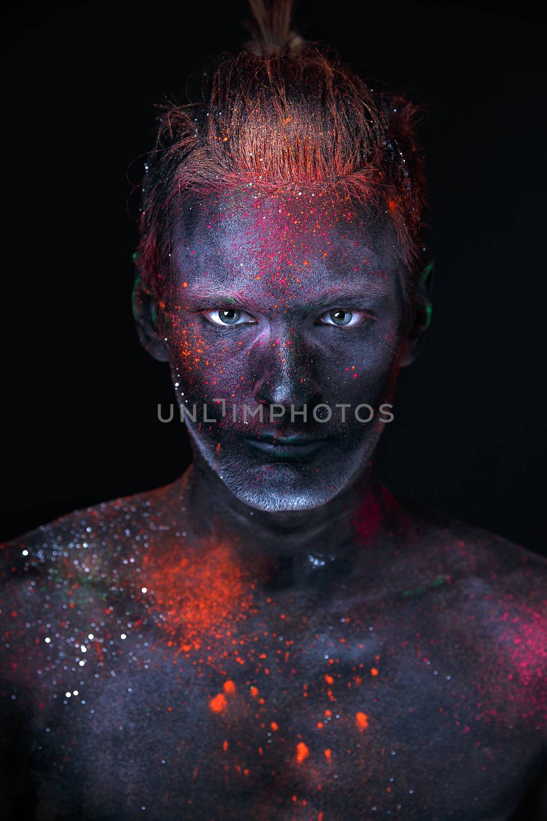 Conceptual shot of light and shine fluorescent  colors young man's face