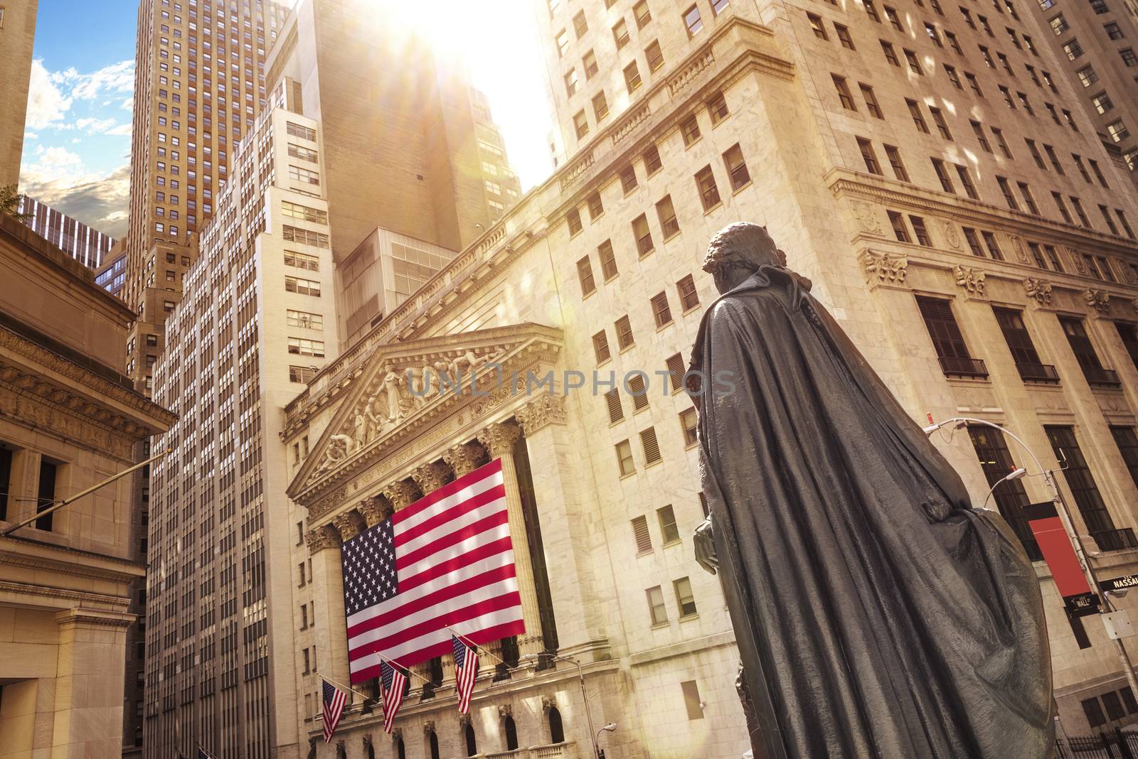 Famous Wall street and the building in New York, New York Stock Exchange with patriot flag