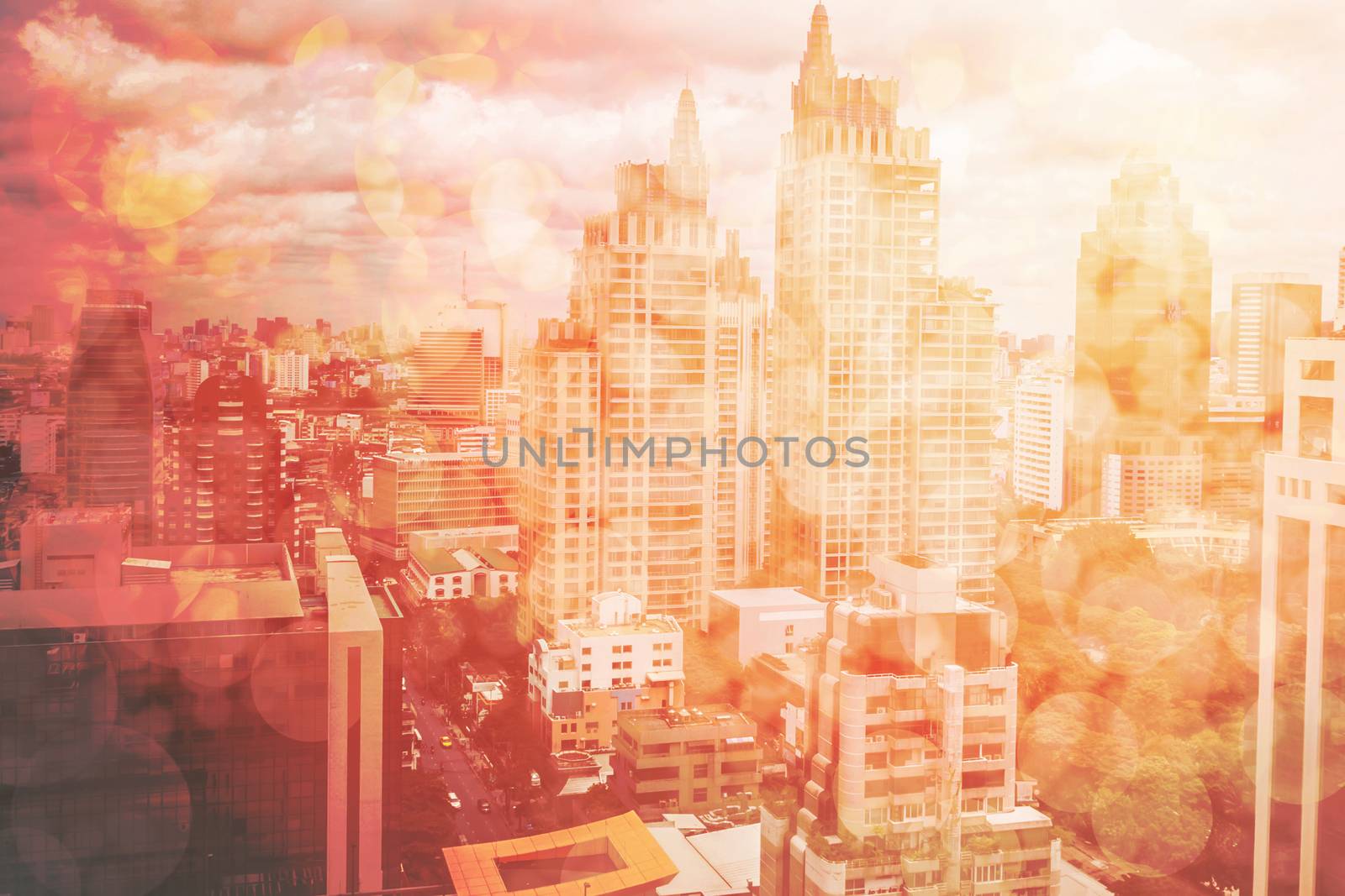 Abstract town background with blurred buildings and street, town on red tone bokeh, abstract urban details and lights