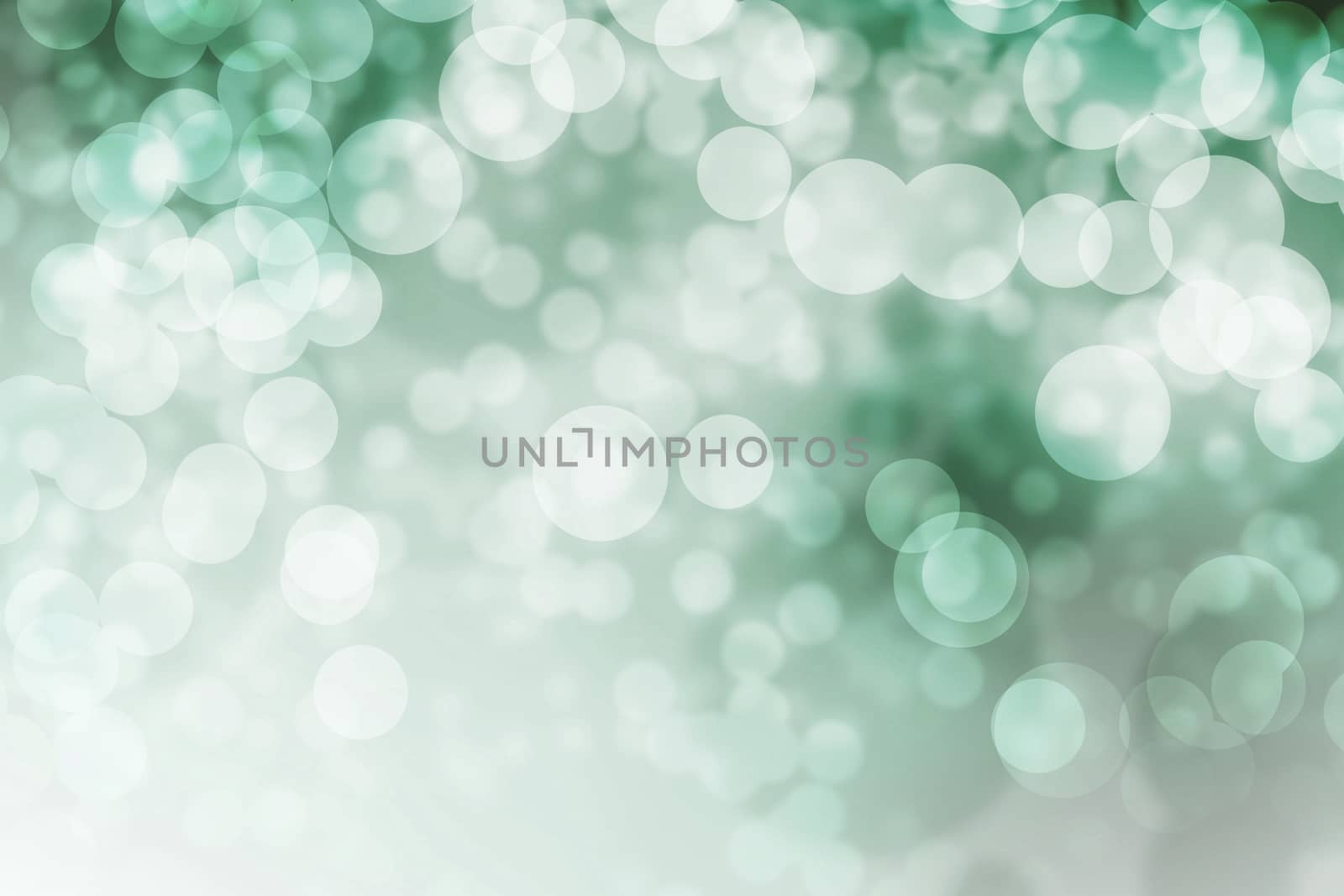 Abstract light bokeh as green background