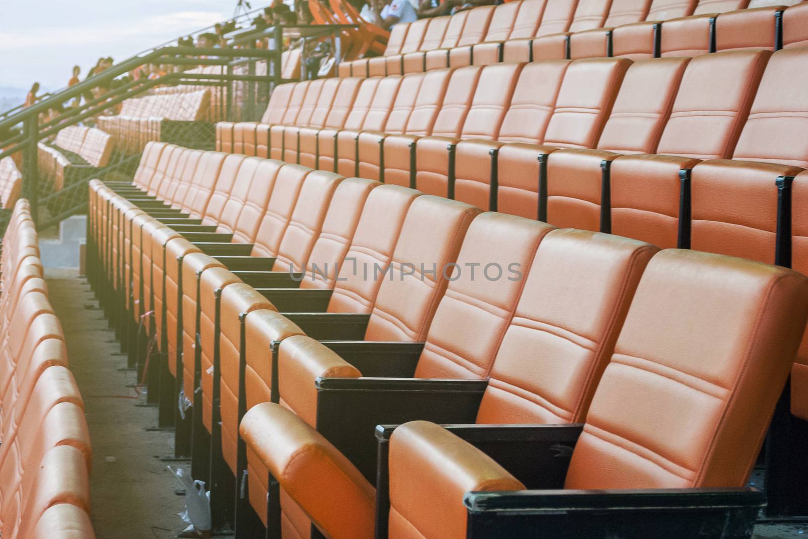 beautiful pattern of the orange seats in the stadium 