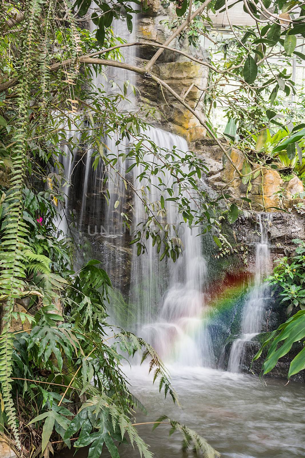 Wonderful Waterfall with rainbows in forest at North of Thailand