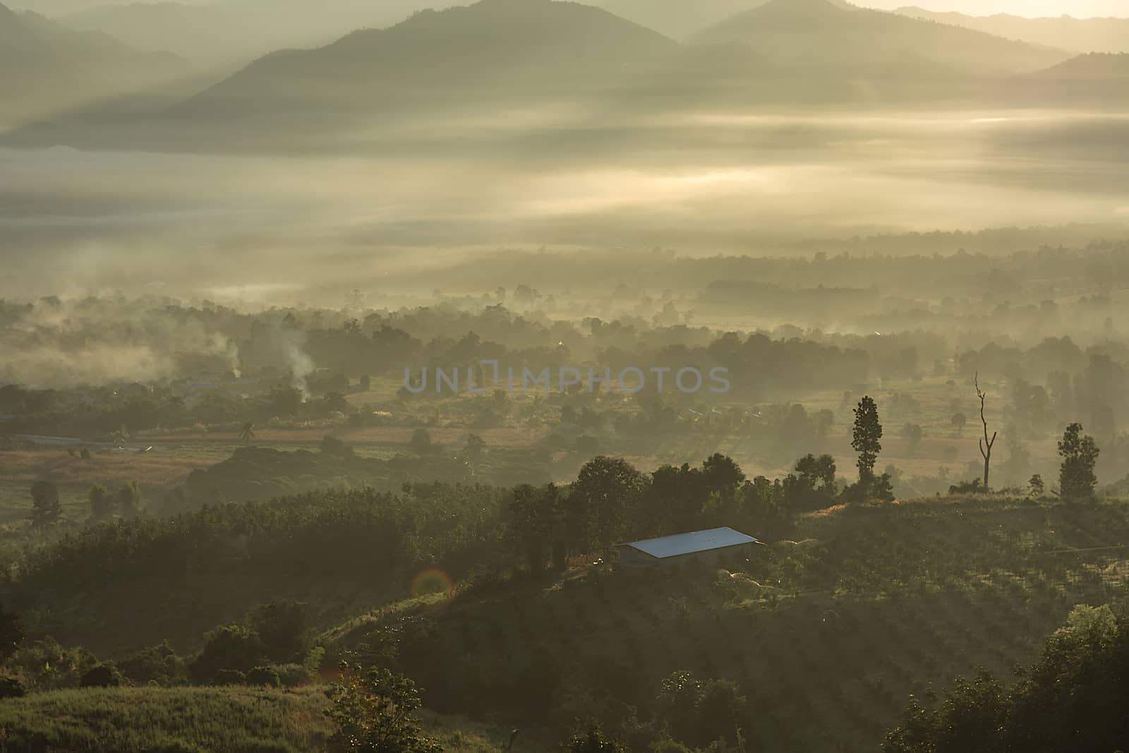 Sunrise at Yoon Lai View Point Smoky fog, The village high in the fog, Mountain National Park, at Pai, Mae Hong Son, Thailand.