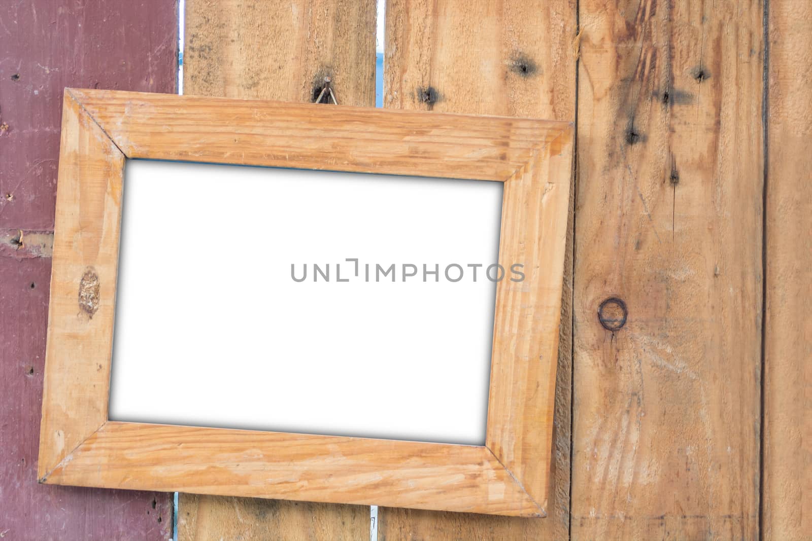 old vintage wooden photo frame on vintage wooden board