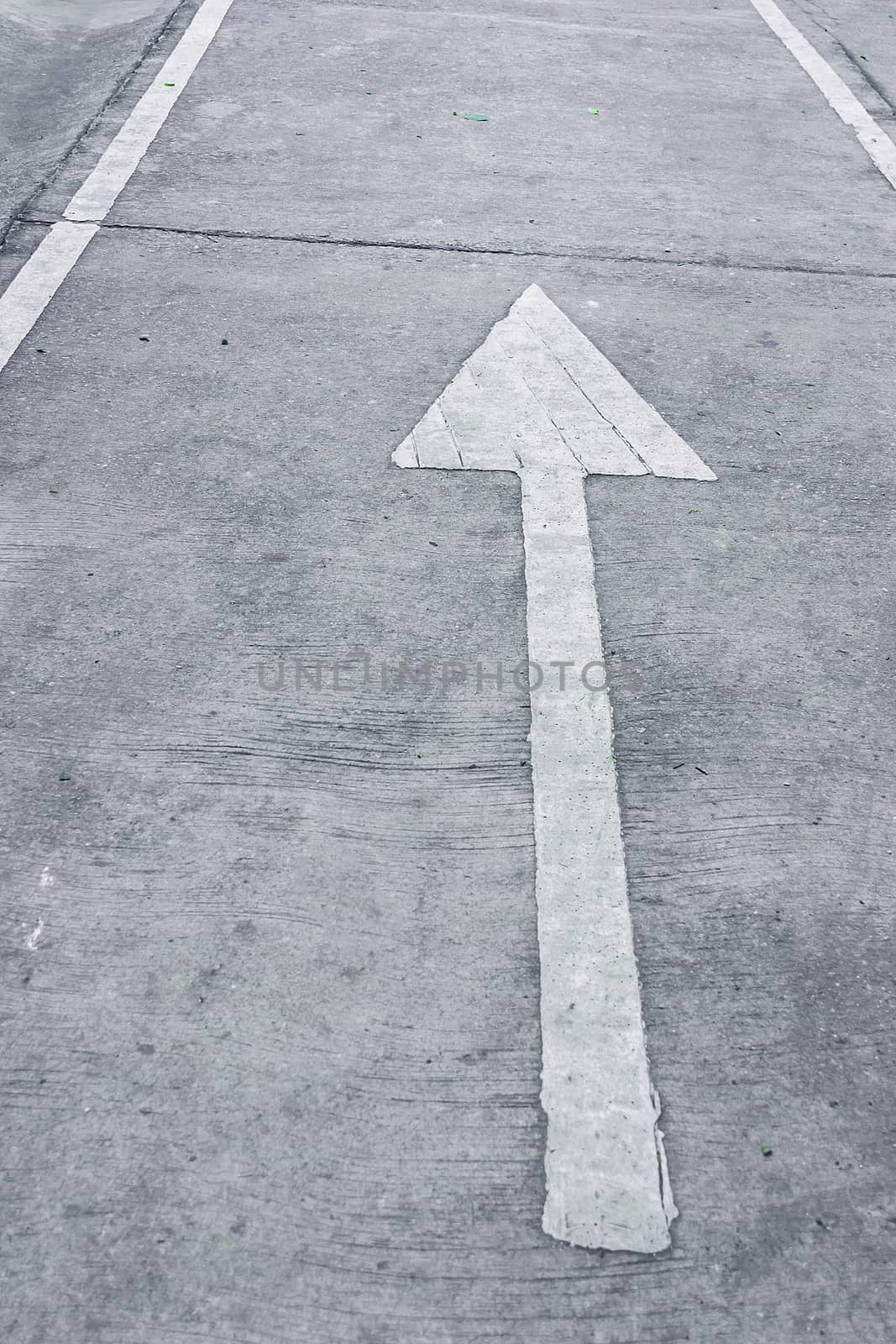 white arrow on road, direction straight. by rakoptonLPN