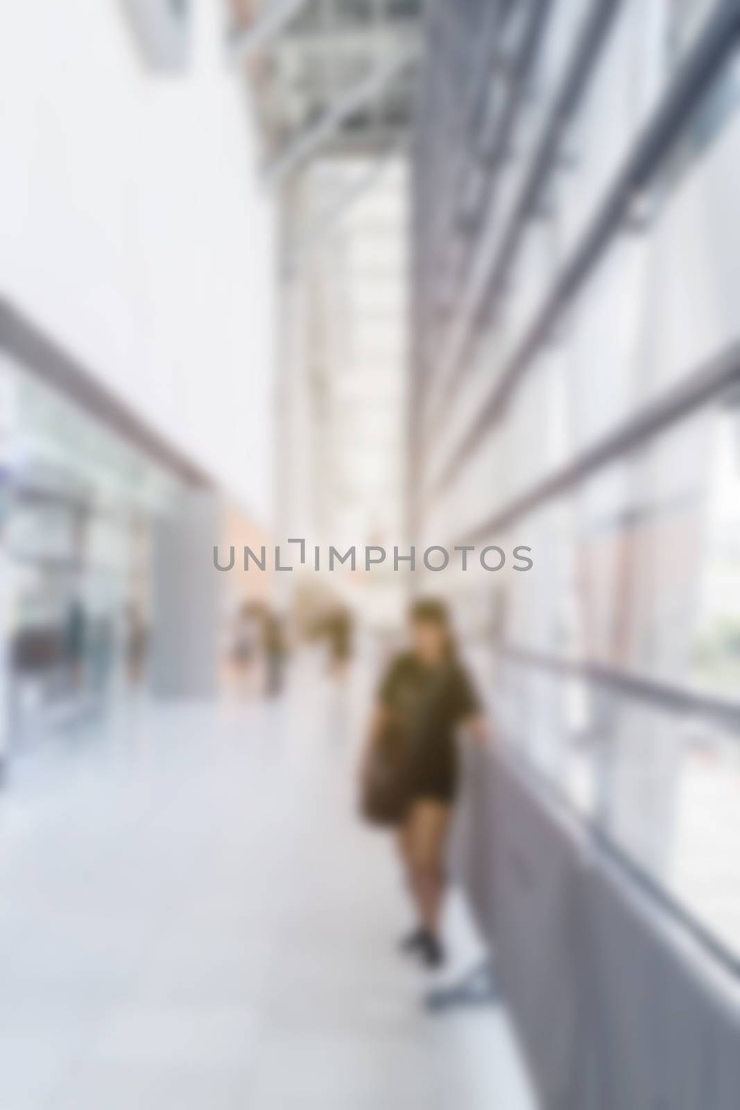 abstract image of woman in town in the rush hour of a modern bus by rakoptonLPN