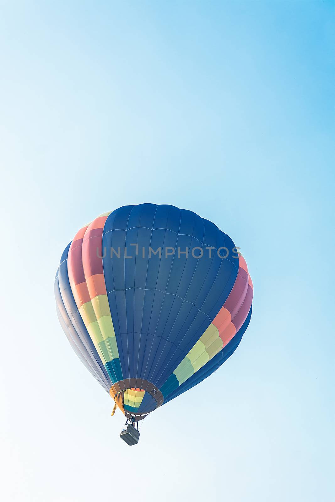 Hot balloon flying in the blue sky by rakoptonLPN