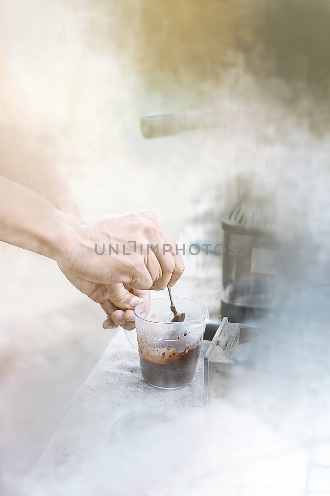Barista mixing milk and chocolate on espresso machine for making by rakoptonLPN