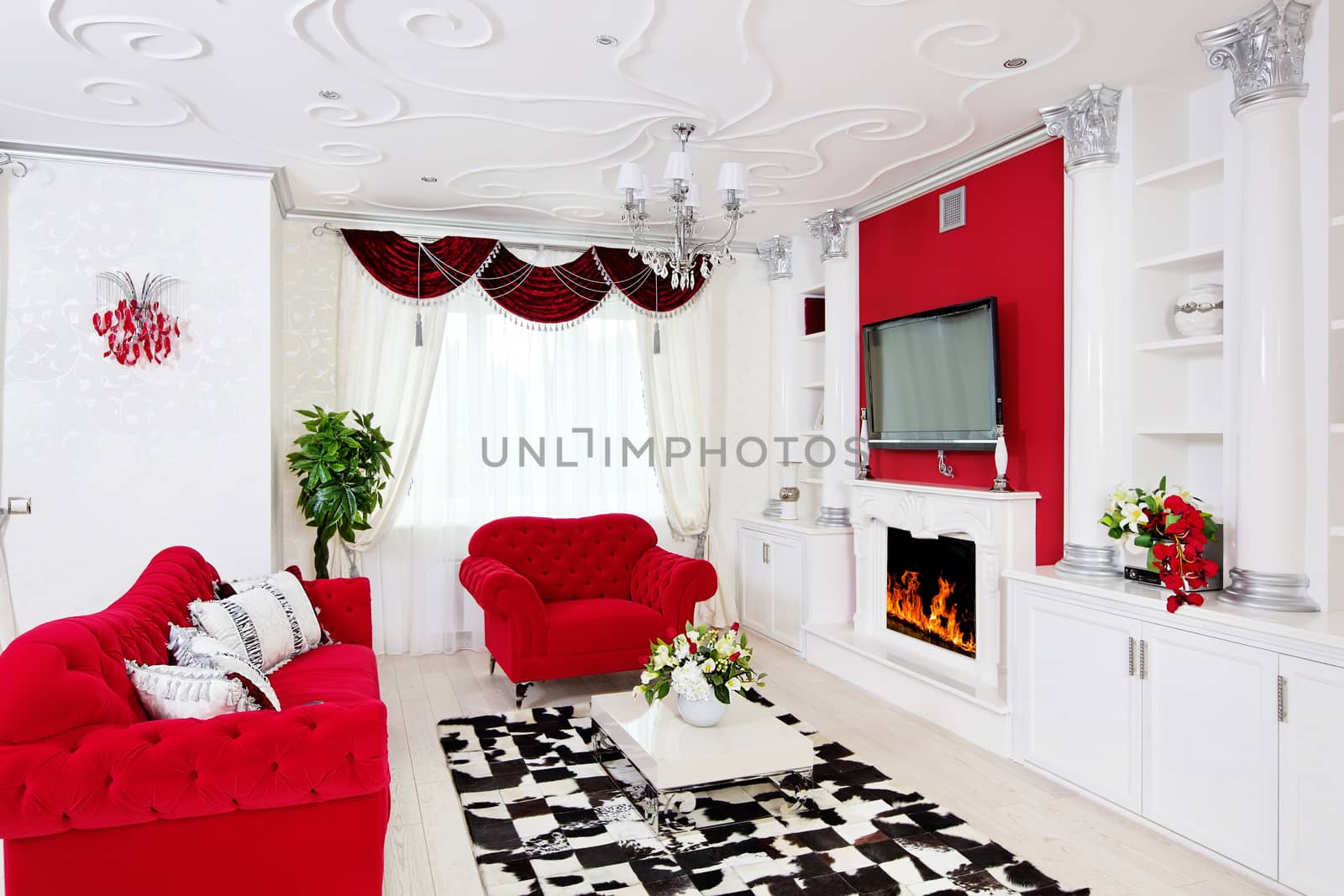 Classical living room interior in white and red with fireplace by RawGroup