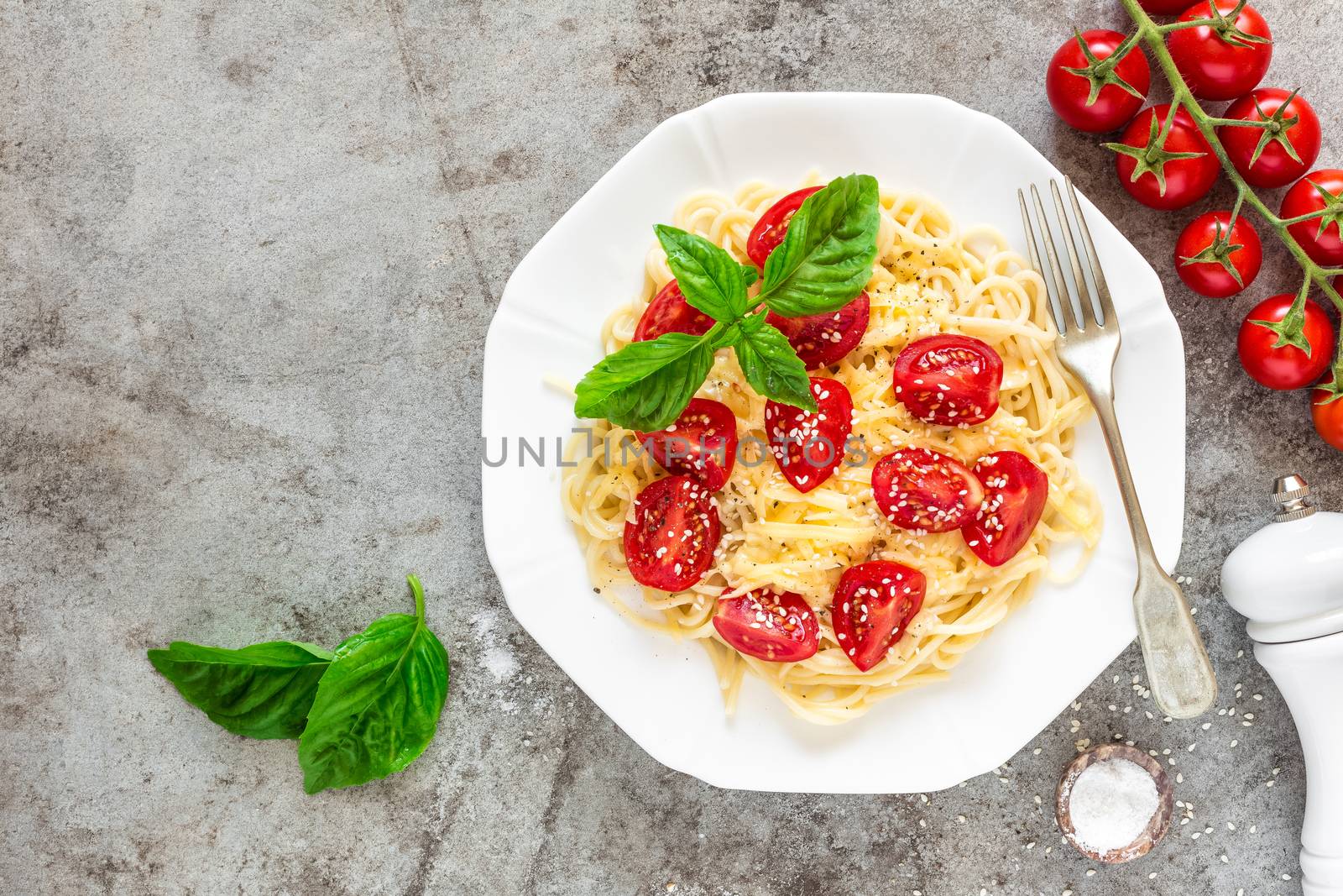 Spaghetti with tomatoes, basil and cheese by yelenayemchuk